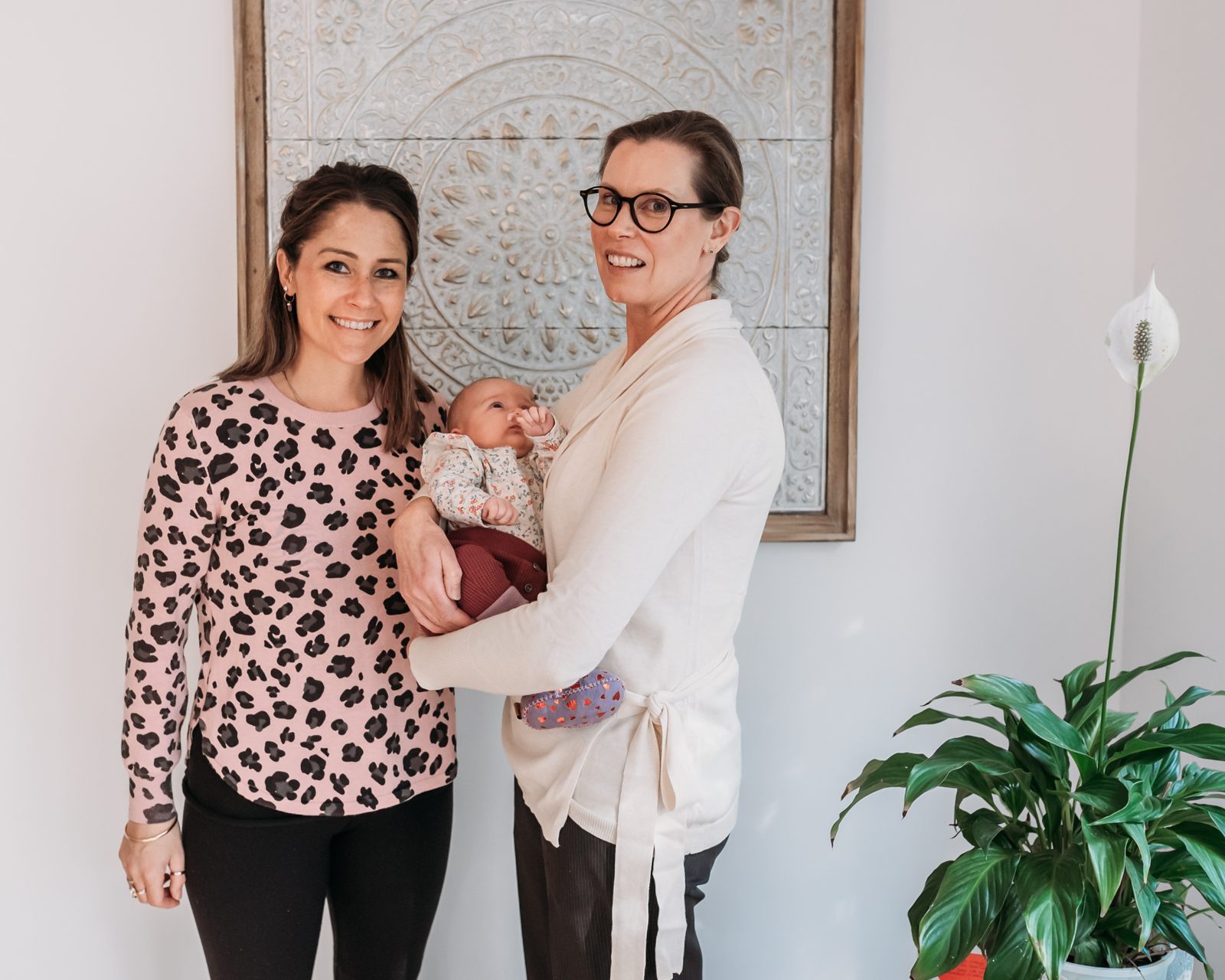 Penny with a mother and her baby at home